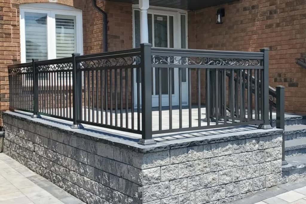 Black aluminum picket railing with decorative spindle design in Queen West, Toronto